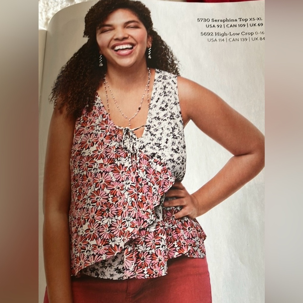 Cabi Seraphina #5730 Daisy ruffled flowy top over spaghetti strapped B&W tank.